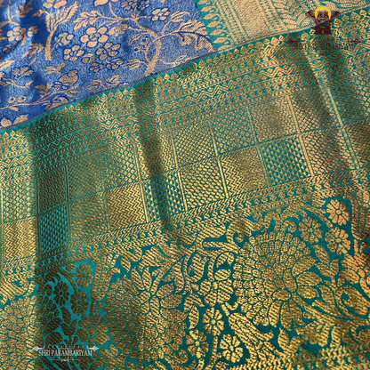 An elegant steel blue / peacock blue Tissue Saree