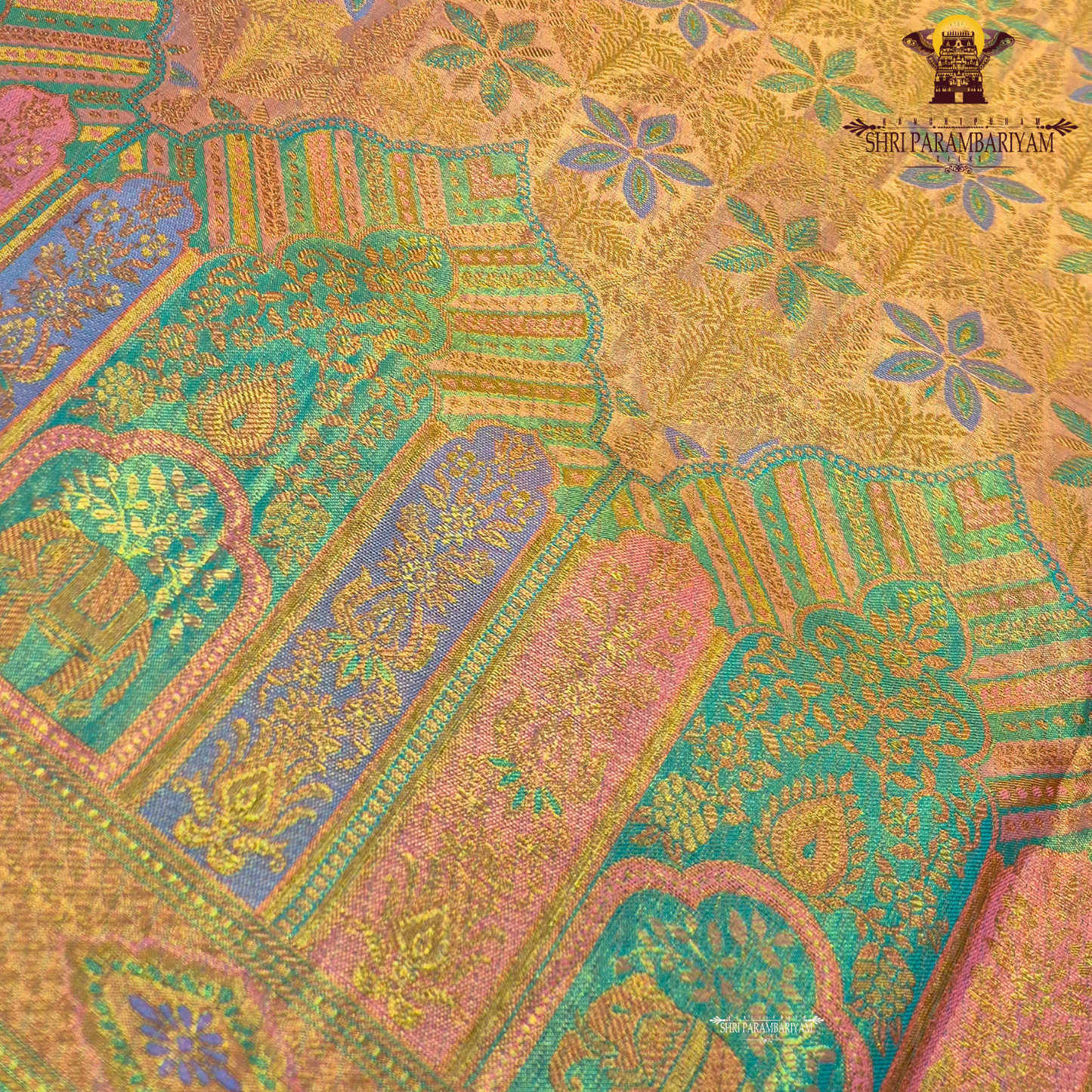 A radiant golden yellow / mustard gold tissue base with subtle pastel green and lavender accents Saree