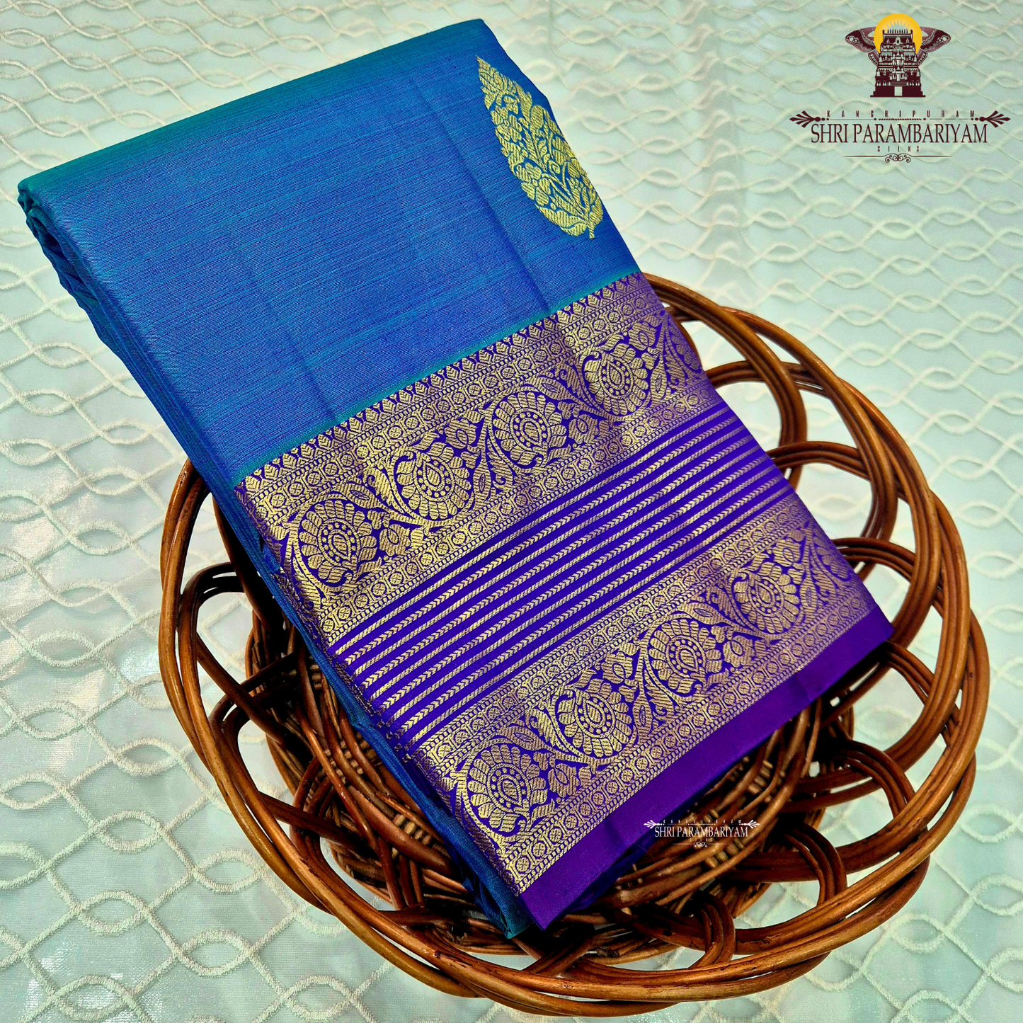 A rich royal blue body with a deep violet (purple) contrast border Saree