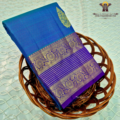 A rich royal blue body with a deep violet (purple) contrast border Saree