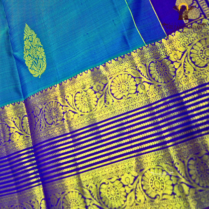A rich royal blue body with a deep violet (purple) contrast border Saree