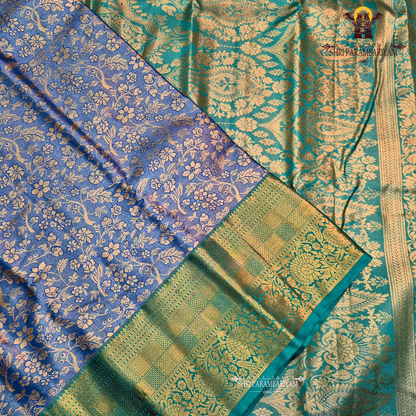 An elegant steel blue / peacock blue Tissue Saree