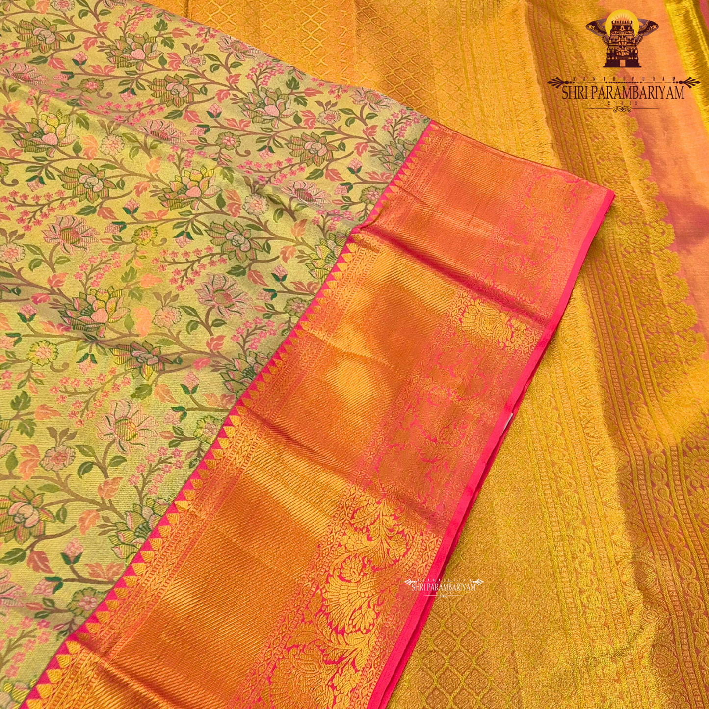 A graceful golden beige / antique gold base with multicolor floral Saree