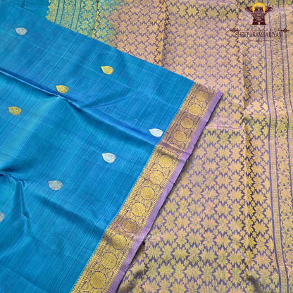 Teal Blue body with Gold zari 2-inch border and contrast Lavender-Purple edge Saree