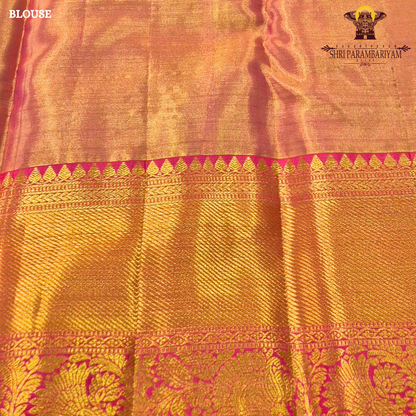 A graceful golden beige / antique gold base with multicolor floral Saree