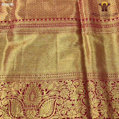 A refreshing lime green body paired with a rich golden tissue pallu and red zari border Saree