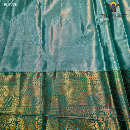 An elegant steel blue / peacock blue Tissue Saree