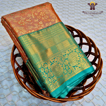 A warm rust orange / copper brown Tissue Saree