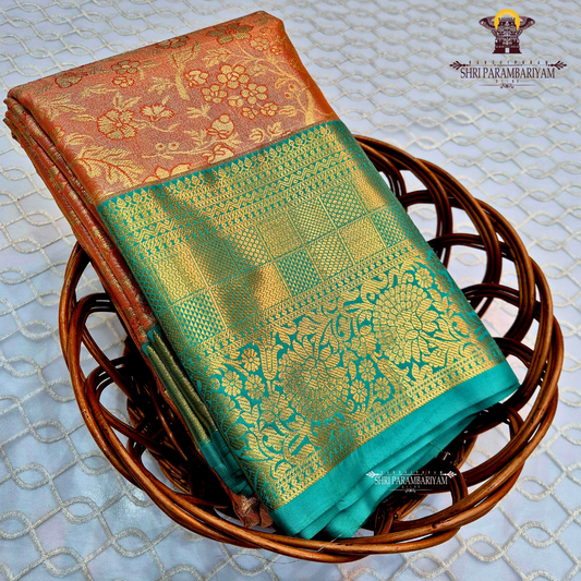A warm rust orange / copper brown Tissue Saree