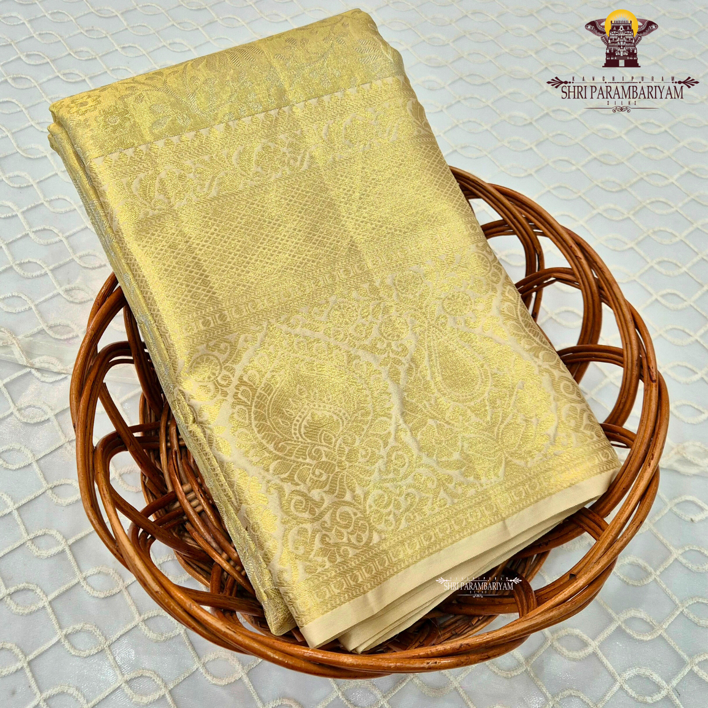 A soft champagne gold / pale gold tissue body with a subtle ivory undertone Saree