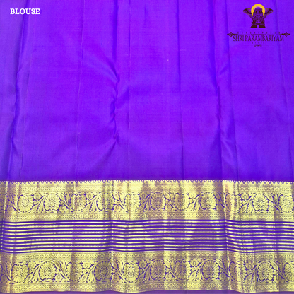 A rich royal blue body with a deep violet (purple) contrast border Saree