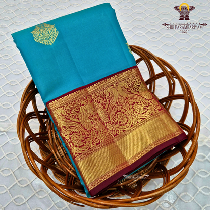 A rich Peacock Blue body highlighted with a beautiful Saree