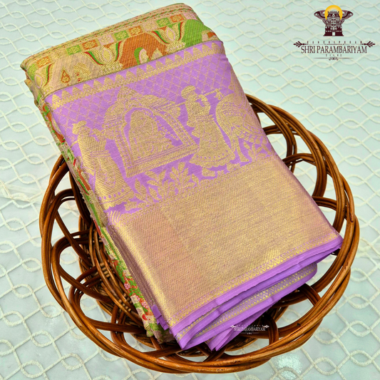 A beautiful lavender / lilac base paired with a rich golden zari pallu, enhanced by a multicolor border Saree