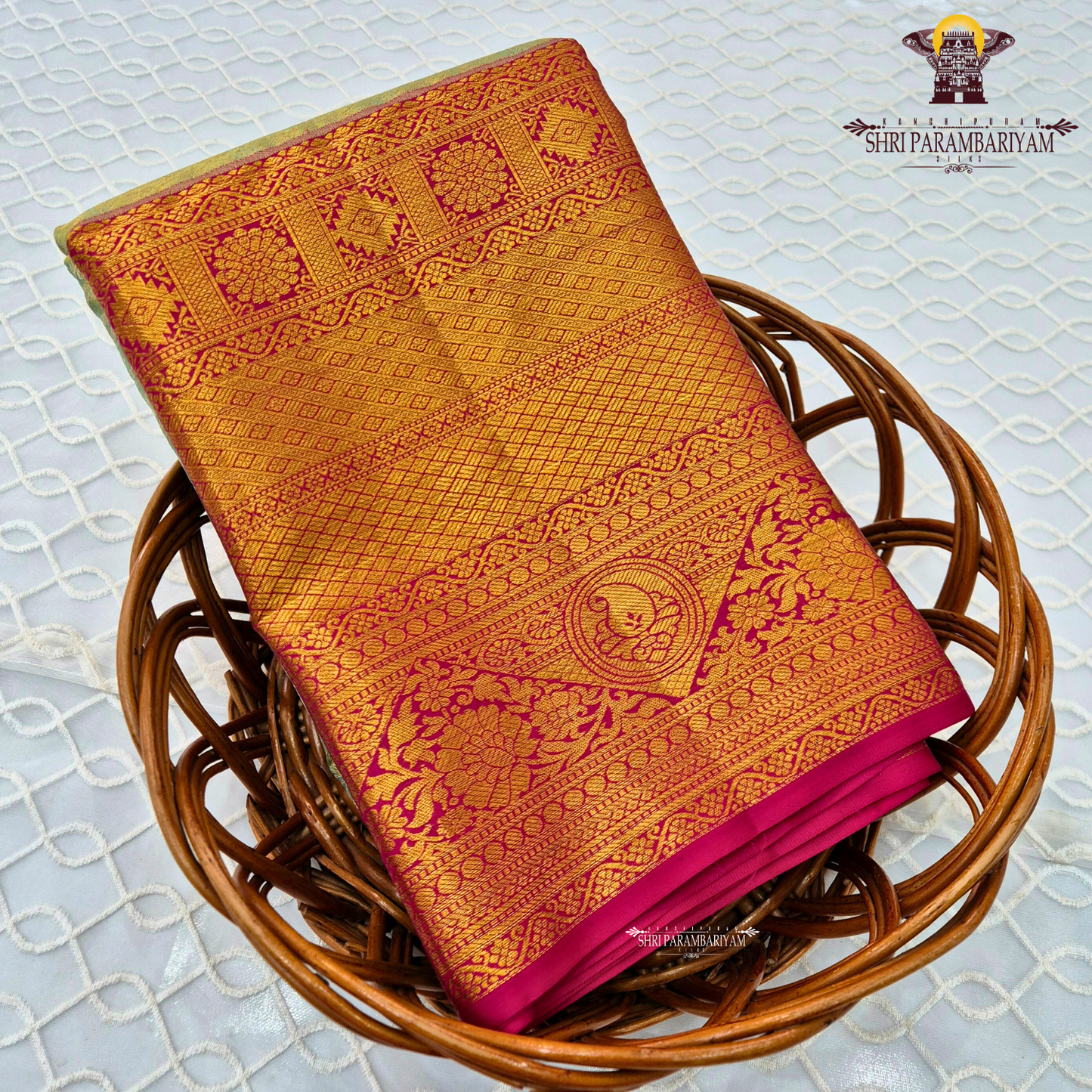 A soft ivory / off-white tissue base with rich antique gold zari work Saree