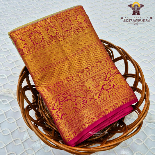 A soft ivory / off-white tissue base with rich antique gold zari work Saree