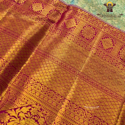 A soft ivory / off-white tissue base with rich antique gold zari work Saree