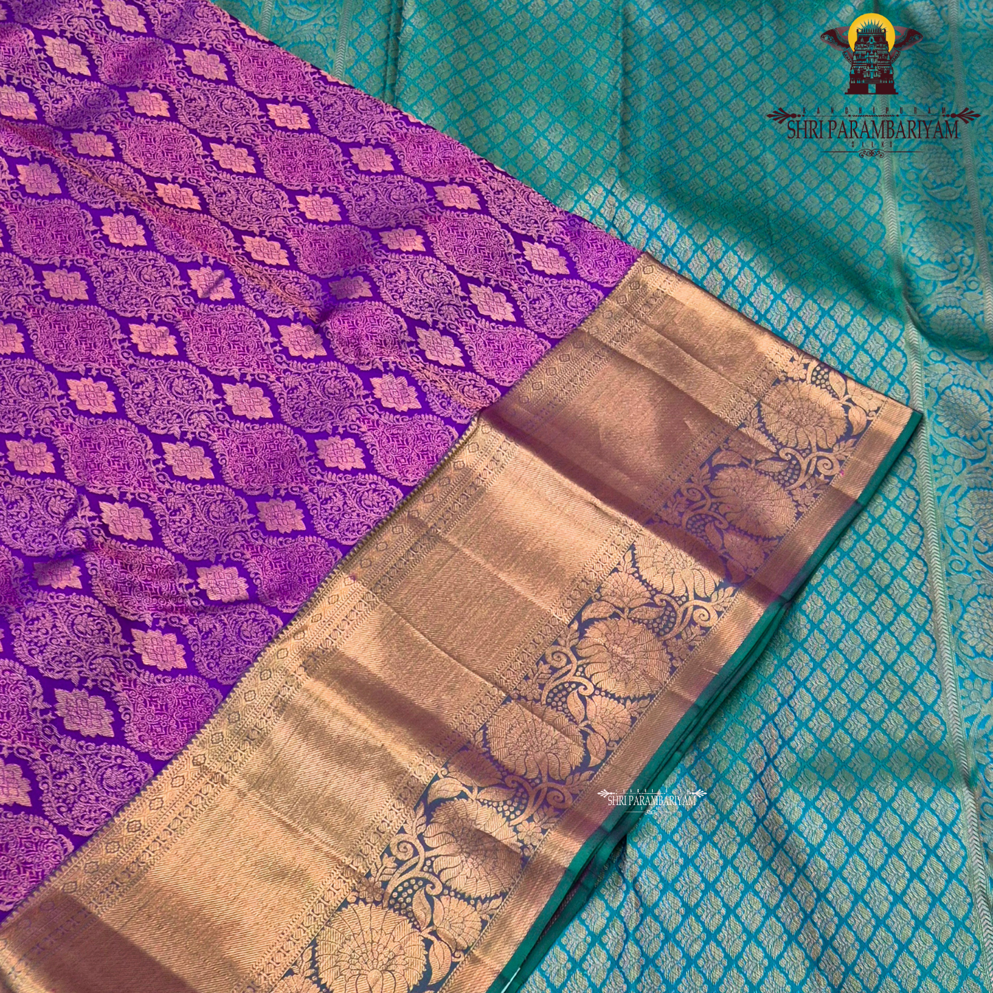 A Royal purple with a teal green border accent and rich gold zari Saree