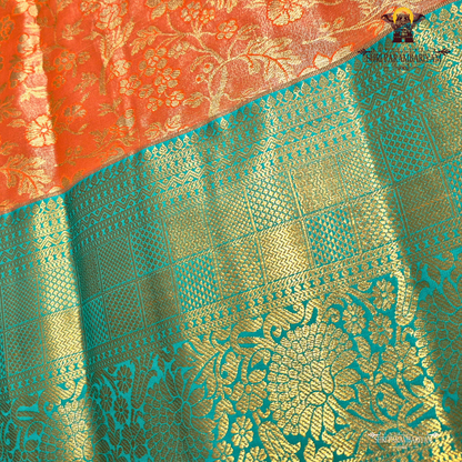 A warm rust orange / copper brown Tissue Saree