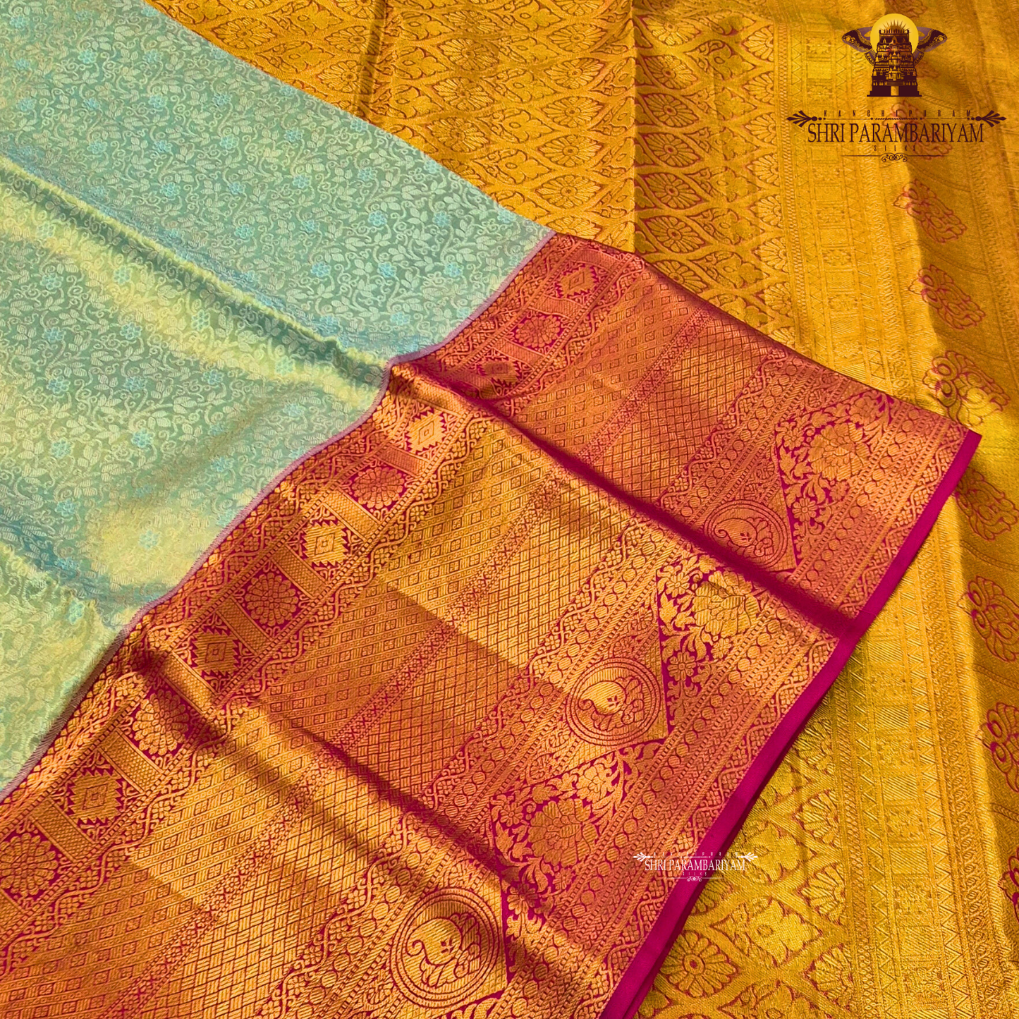 A soft ivory / off-white tissue base with rich antique gold zari work Saree