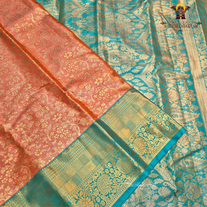 A warm rust orange / copper brown Tissue Saree