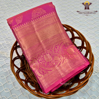 A bright and rich deep pink (rani pink) with radiant gold zari work Saree