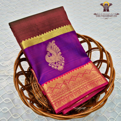 A classic tri-tone rusty maroon, royal purple, and deep pink (rani) Saree