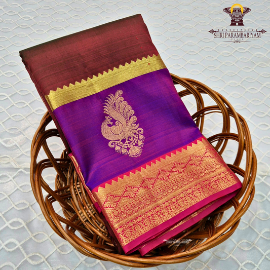 A classic tri-tone rusty maroon, royal purple, and deep pink (rani) Saree