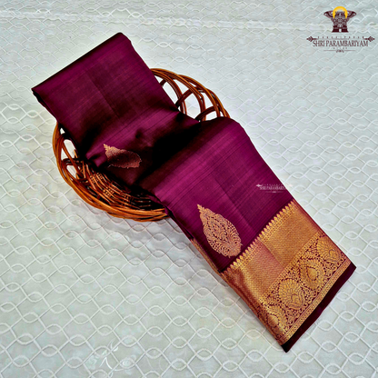 A elegant Magenta Purple / Dark Rani Pink with a rich silk sheen Saree