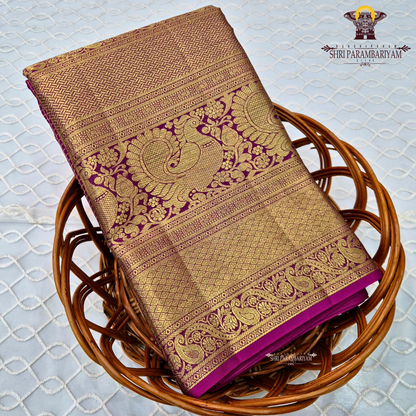 A luxurious antique gold body with a rich deep magenta / rani pink Saree