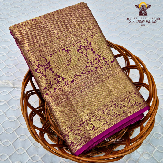A luxurious antique gold body with a rich deep magenta / rani pink Saree