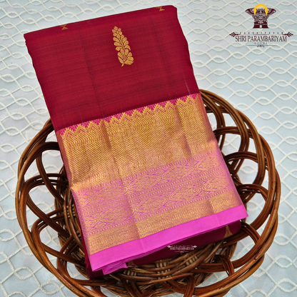 Elegant Deep Maroon body with a rich Pink border and pallu Saree