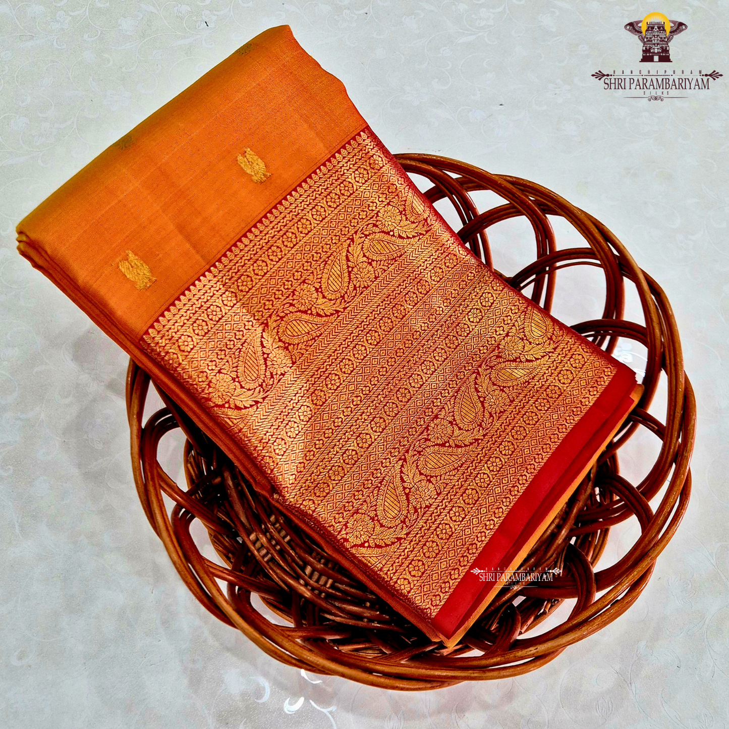 A golden Orange / Mango Orange with Rich Red and Gold Zari Border Saree