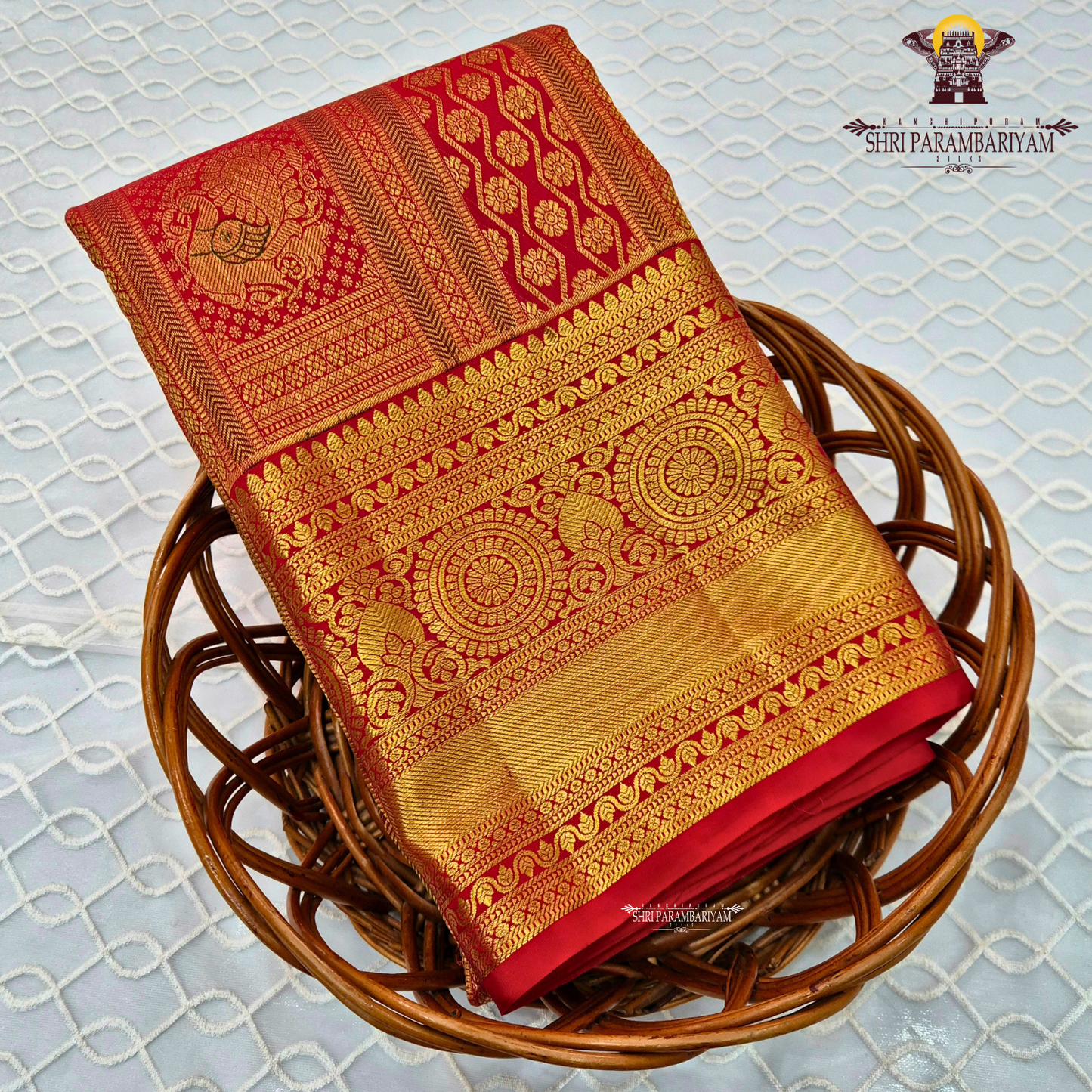 Bright vermilion red with rich antique gold zari accents Saree