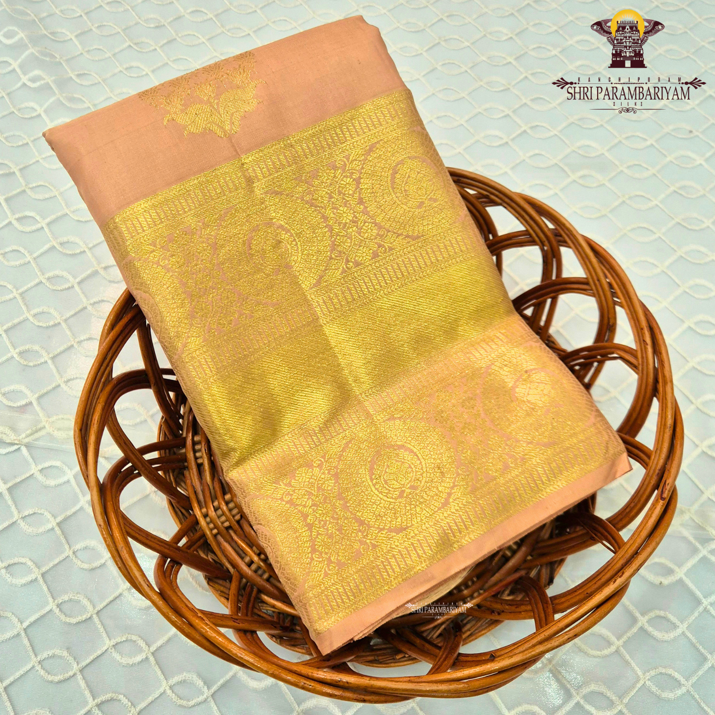 A elegant Soft Peach with Rich Gold Zari Saree