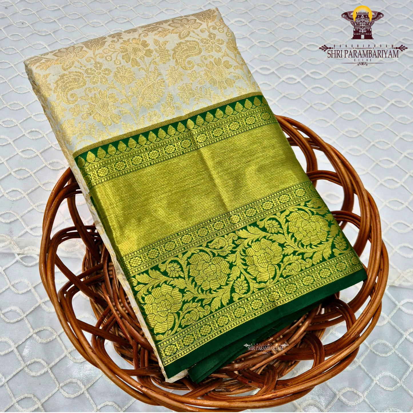 Soft half white (ivory/off-white) body with bottle green contrast border Saree