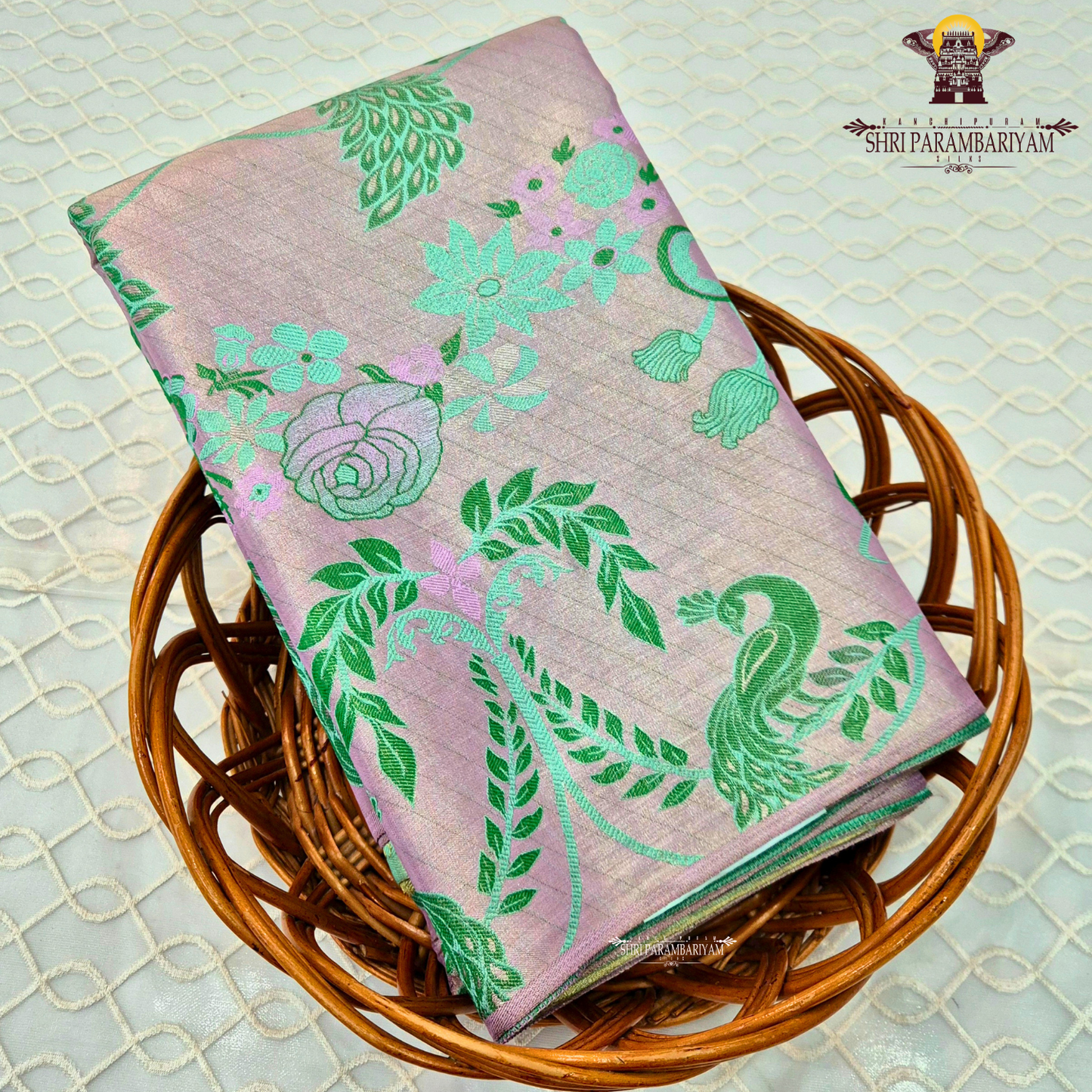 Soft pastel lavender-pink base with contrasting Saree