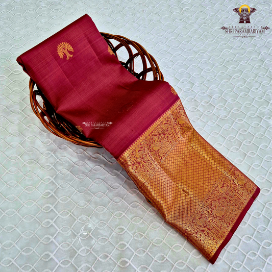 A vibrant Rani Pink (Deep Rose Pink) shade, radiating Saree