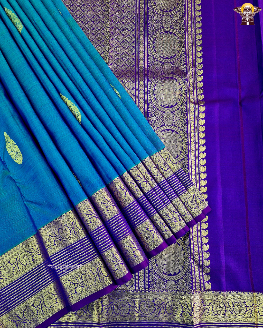 A rich royal blue body with a deep violet (purple) contrast border Saree
