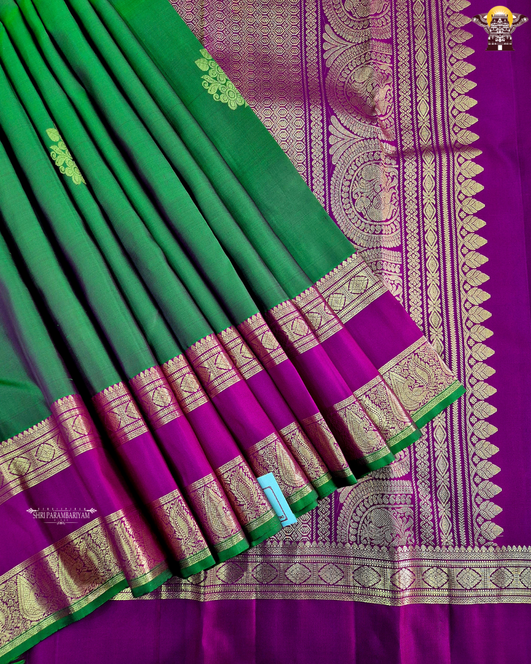 A elegant Bottle Green with Rani Pink contrast and rich Gold zari work Saree