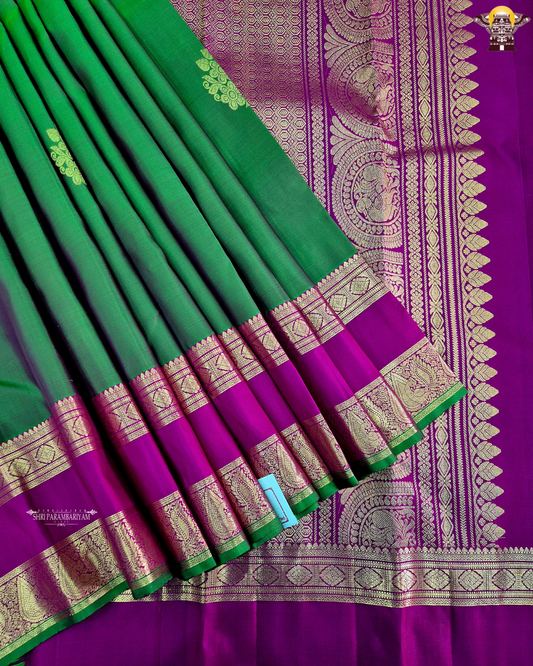 A elegant Bottle Green with Rani Pink contrast and rich Gold zari work Saree